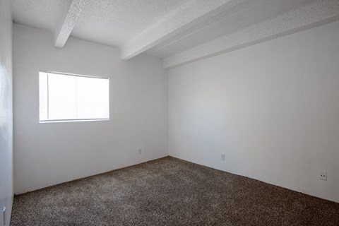 Bedroom with carpet at Los Altos Towers Apartments in Albuquerque NM